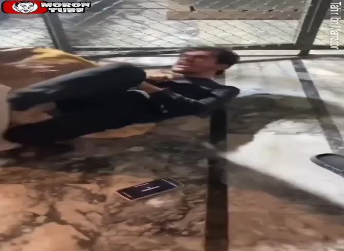 Video :A man who attempted to snap a photo with a pet lion is attacked by the animal (Warning - disturbing)